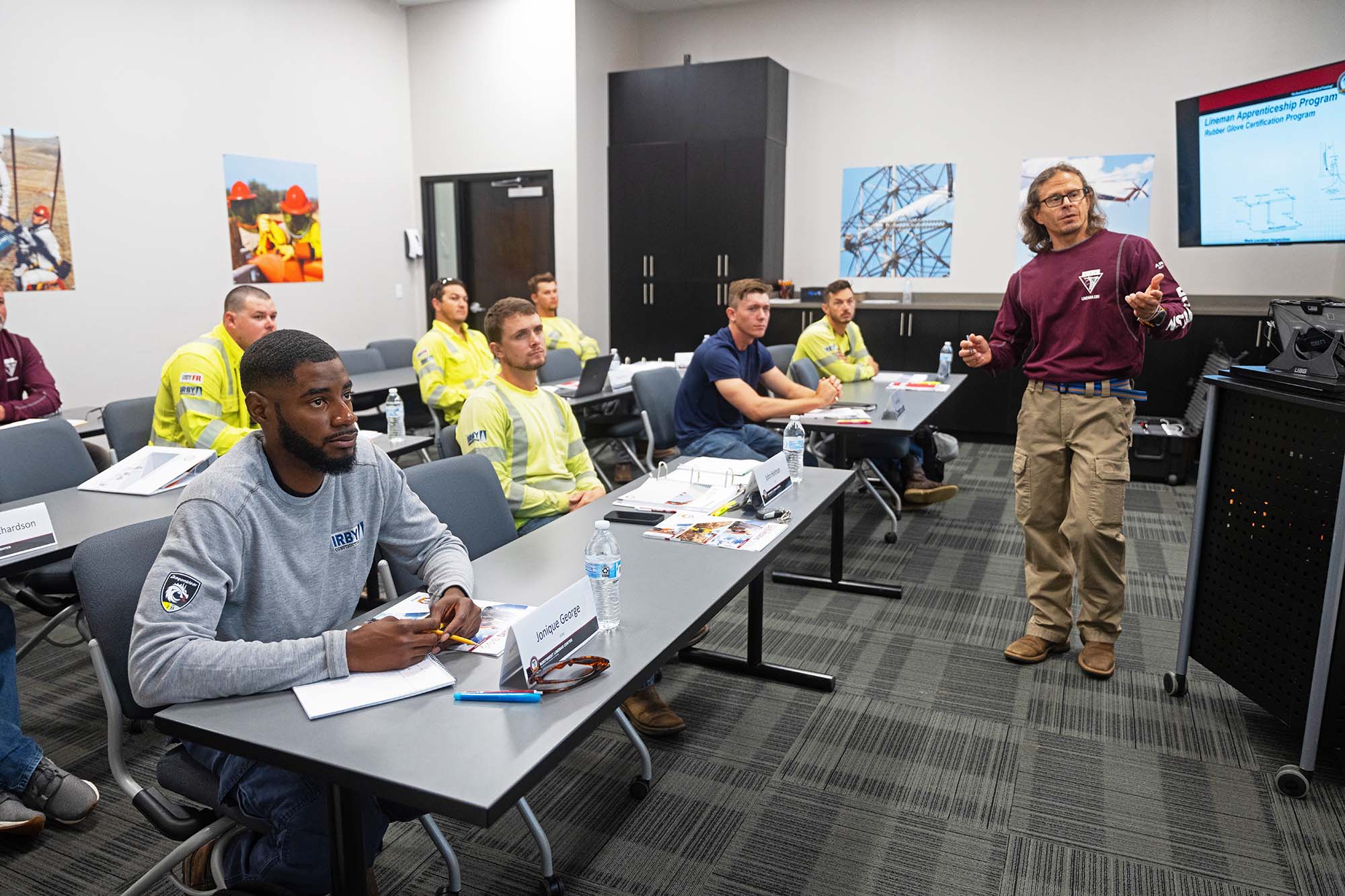 Instructor teaching to classroom of students.